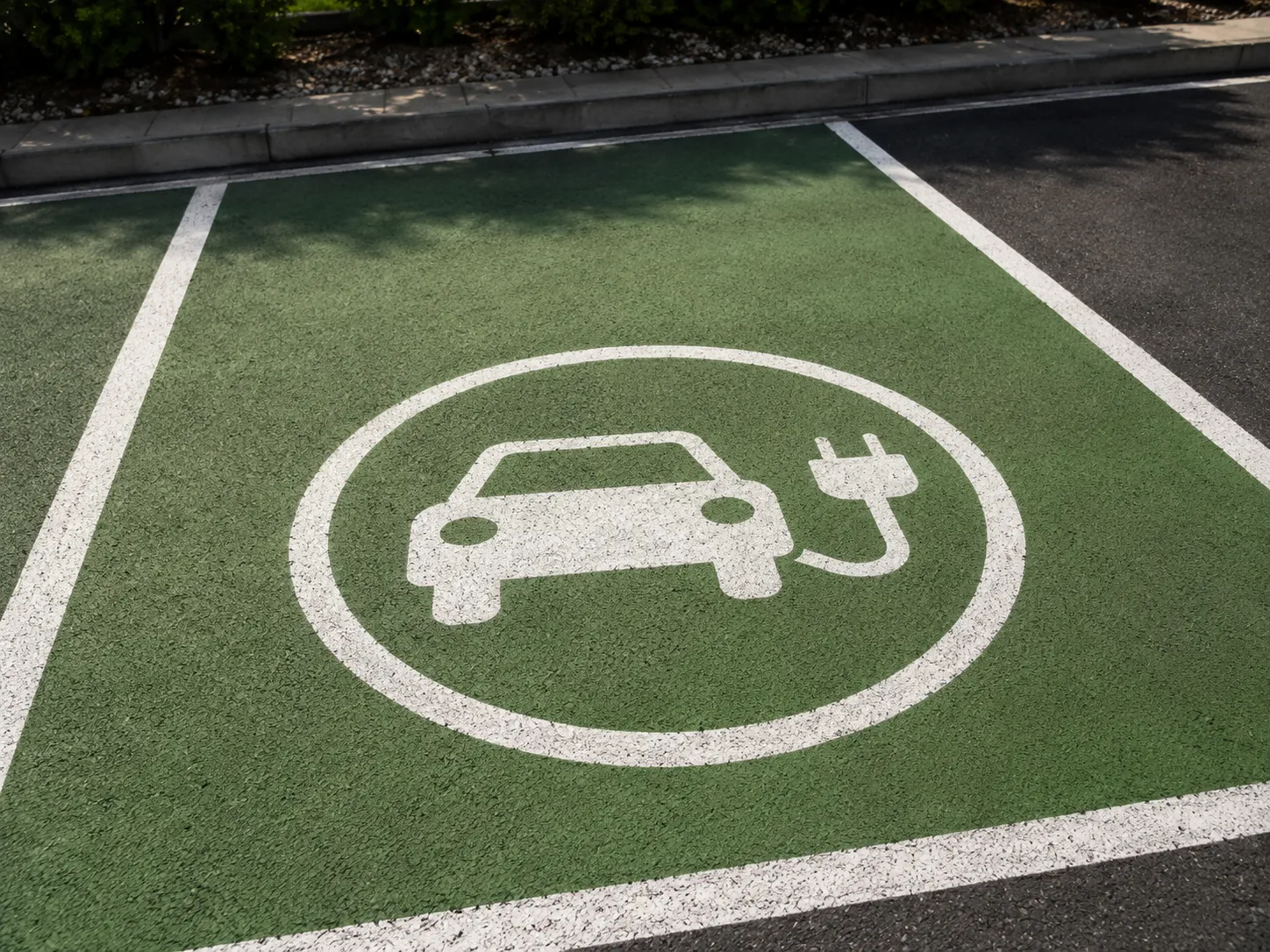 EV charging symbol stencilled onto a marked charging bay
