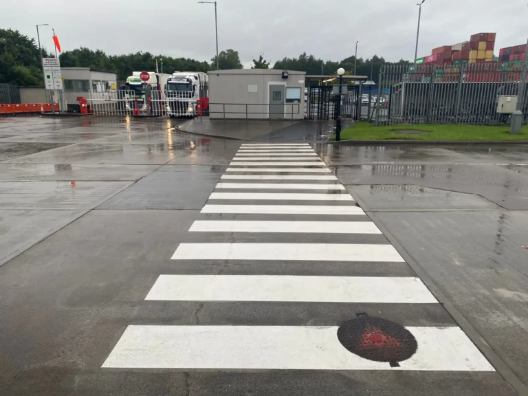 Pedestrian crossing line marking at an industrial factory and logistics site